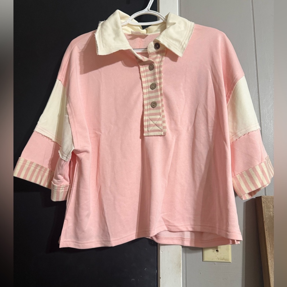 Pink and Cream women’s polo top